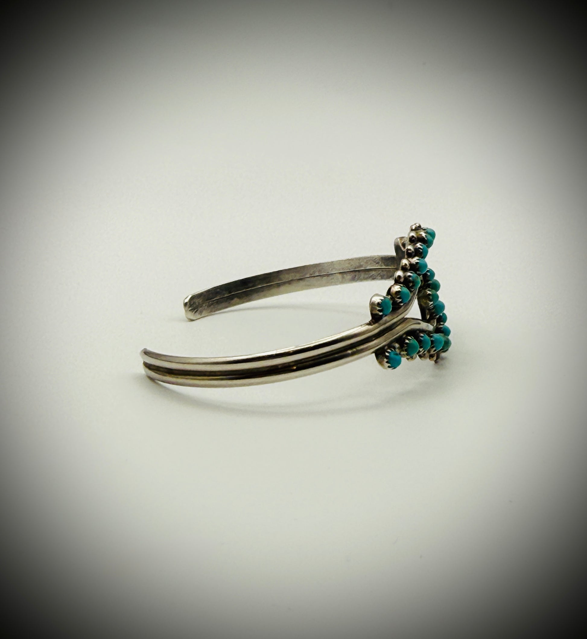 Vintage Zuni Sterling Snake-Eye Turquoise Cuff — artist-stamped HRG