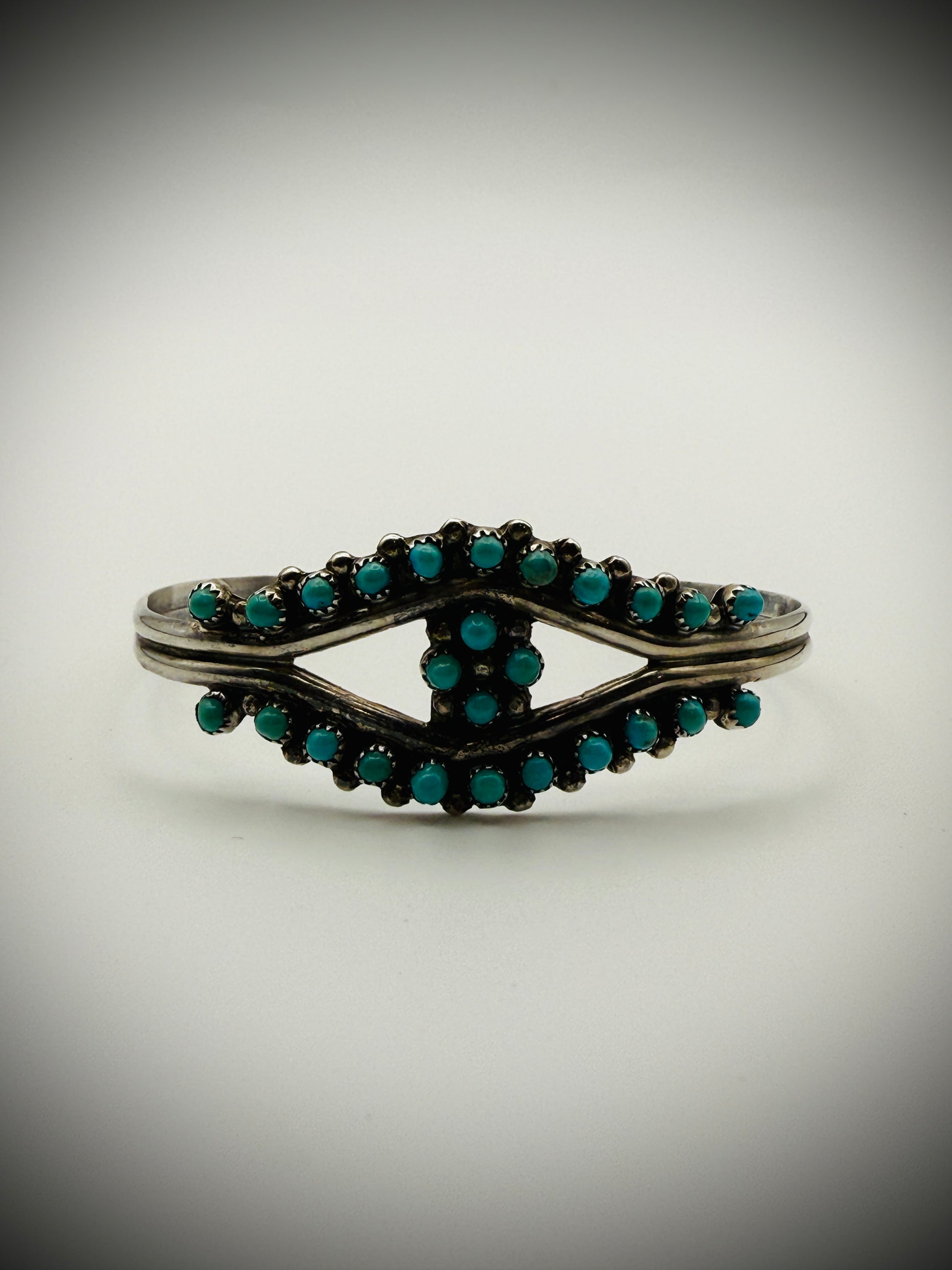 Vintage Zuni Sterling Snake-Eye Turquoise Cuff — artist-stamped HRG